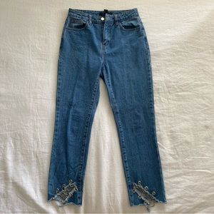 Jeans with chains at the ankle